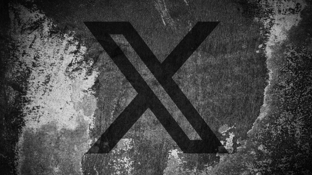Elon Musk teases a new image-labeling system for X… we think? X (formerly Twitter) logo on a cracked wall