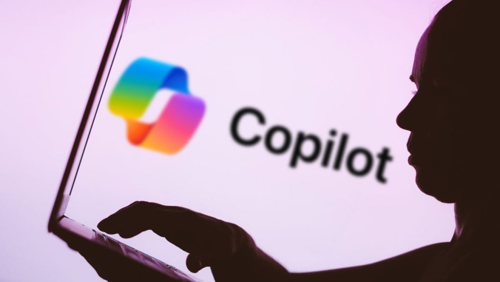 Microsoft says Office bug exposed customers’ confidential emails to Copilot AI In this photo illustration, the Microsoft Copilot logo is seen in the background next to a silhouette of a person using a notebook.