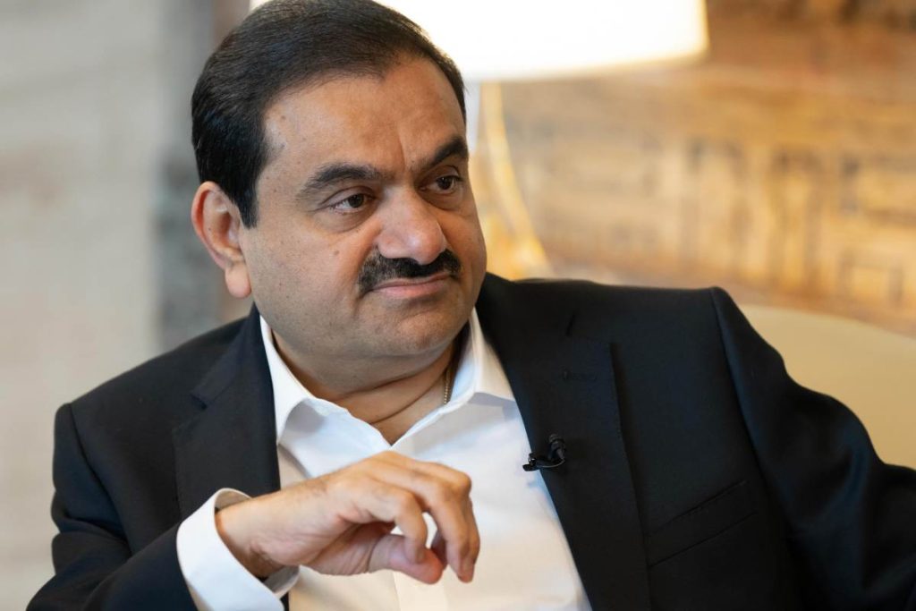 Adani pledges $100B to build AI data centers as India seeks bigger role in the global AI race Gautam Adani, chairman of Adani Group, sits during a television interview.