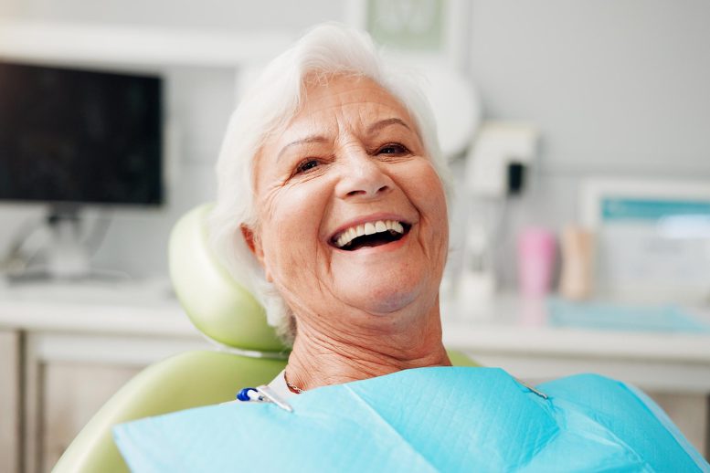 Treating a Common Dental Infection May Have Effects That Extend Far Beyond the Mouth Happy Smiling Senior Woman Dental Treatment Dentist Office
