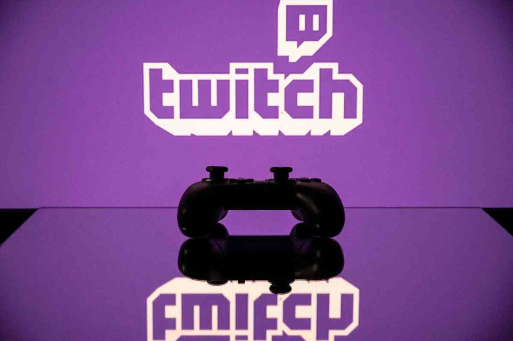 Twitch is overhauling its suspensions policy Twitch logo reflection with a controller